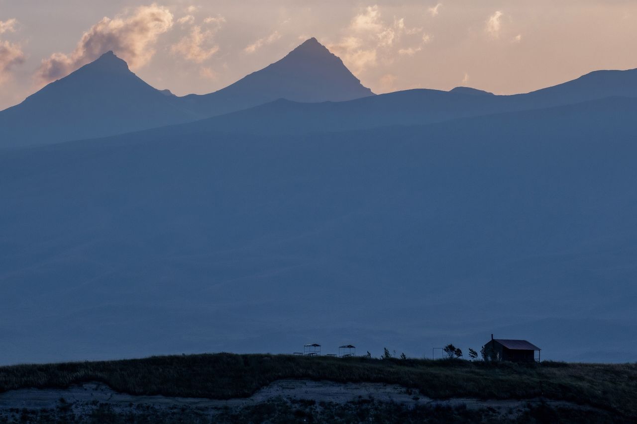 Aragats' peaks against the evening sky, seen from the Aparan reservoir