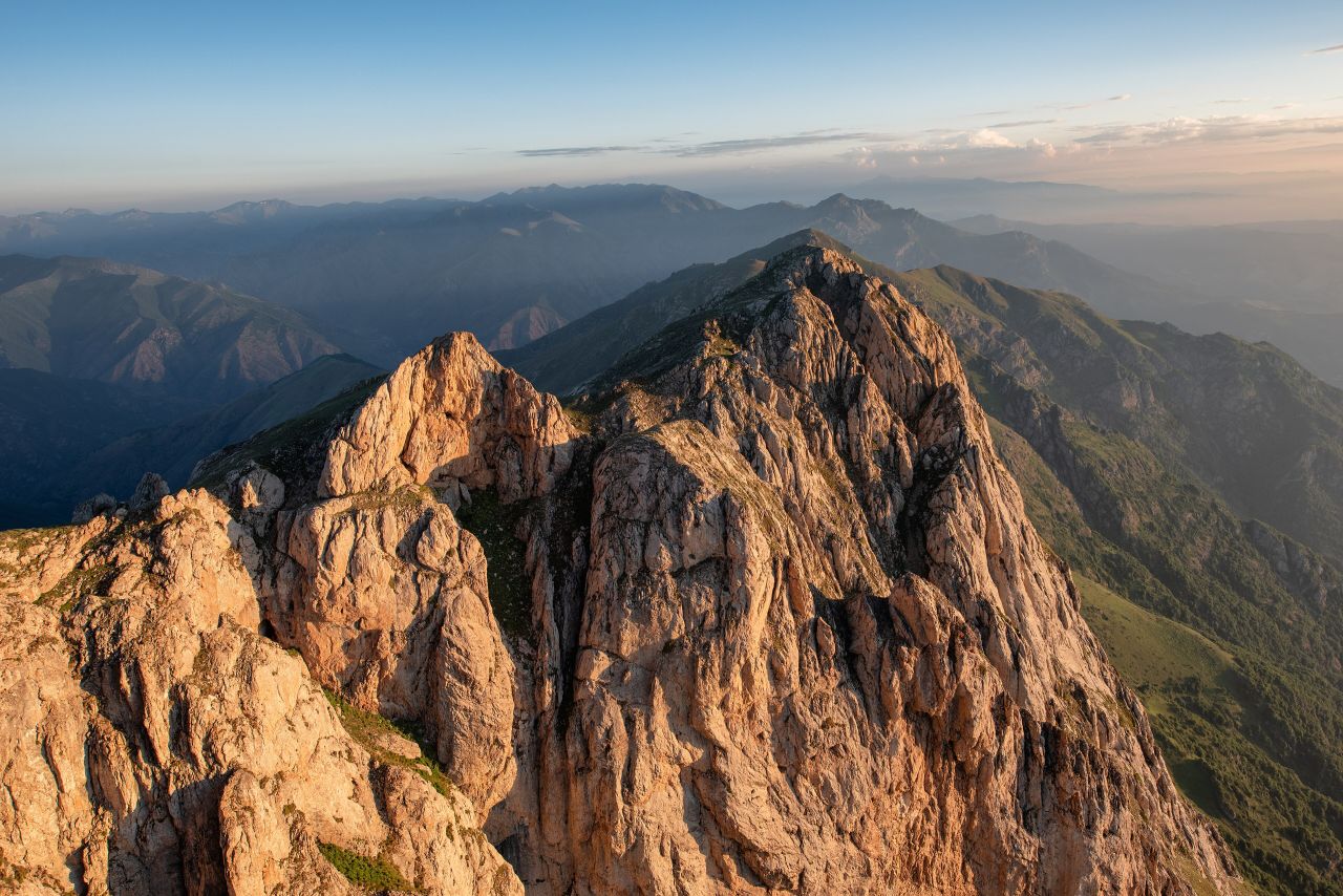 The rocky ridge of Mount Khustup in the light of sunrise